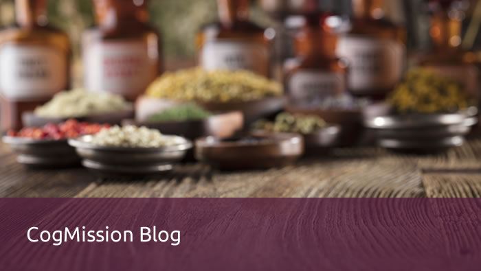 Dried herbs and spices in small bowls before amber apothecary bottles, with a "CogMission Blog" banner